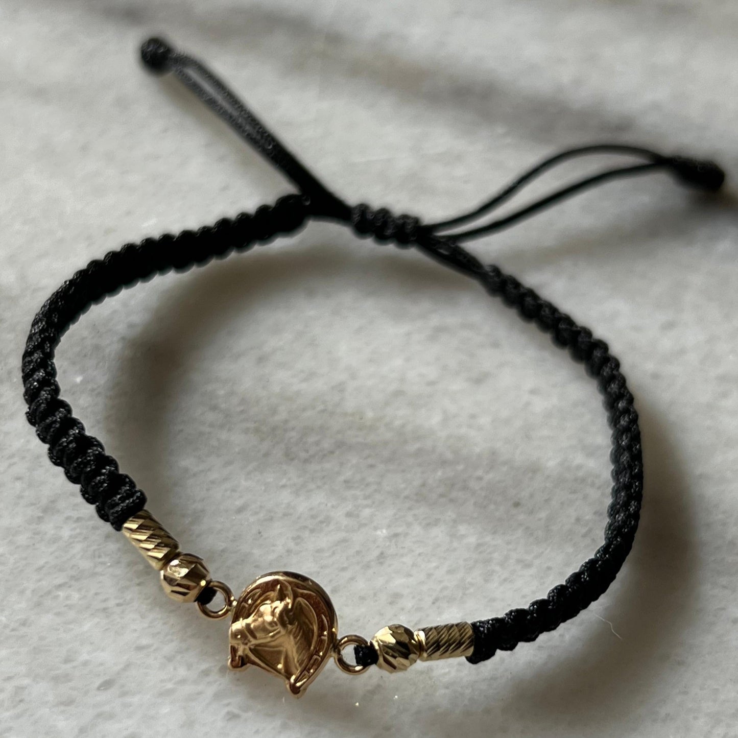 PULSERA TEJIDA HERRADURA ORO 18K